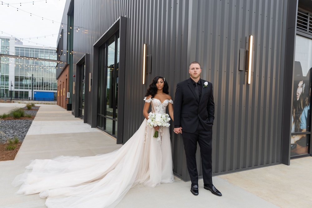 Bride and groom outside of PINE