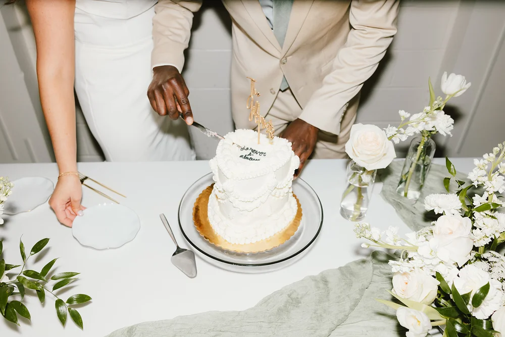 Bride and groom cutting their heart-shaped wedding cake