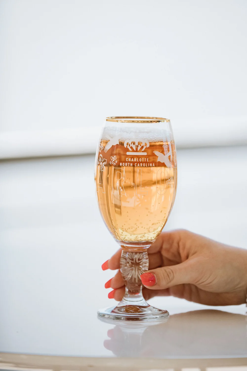 Beer glass with a light colored beer at company holiday party