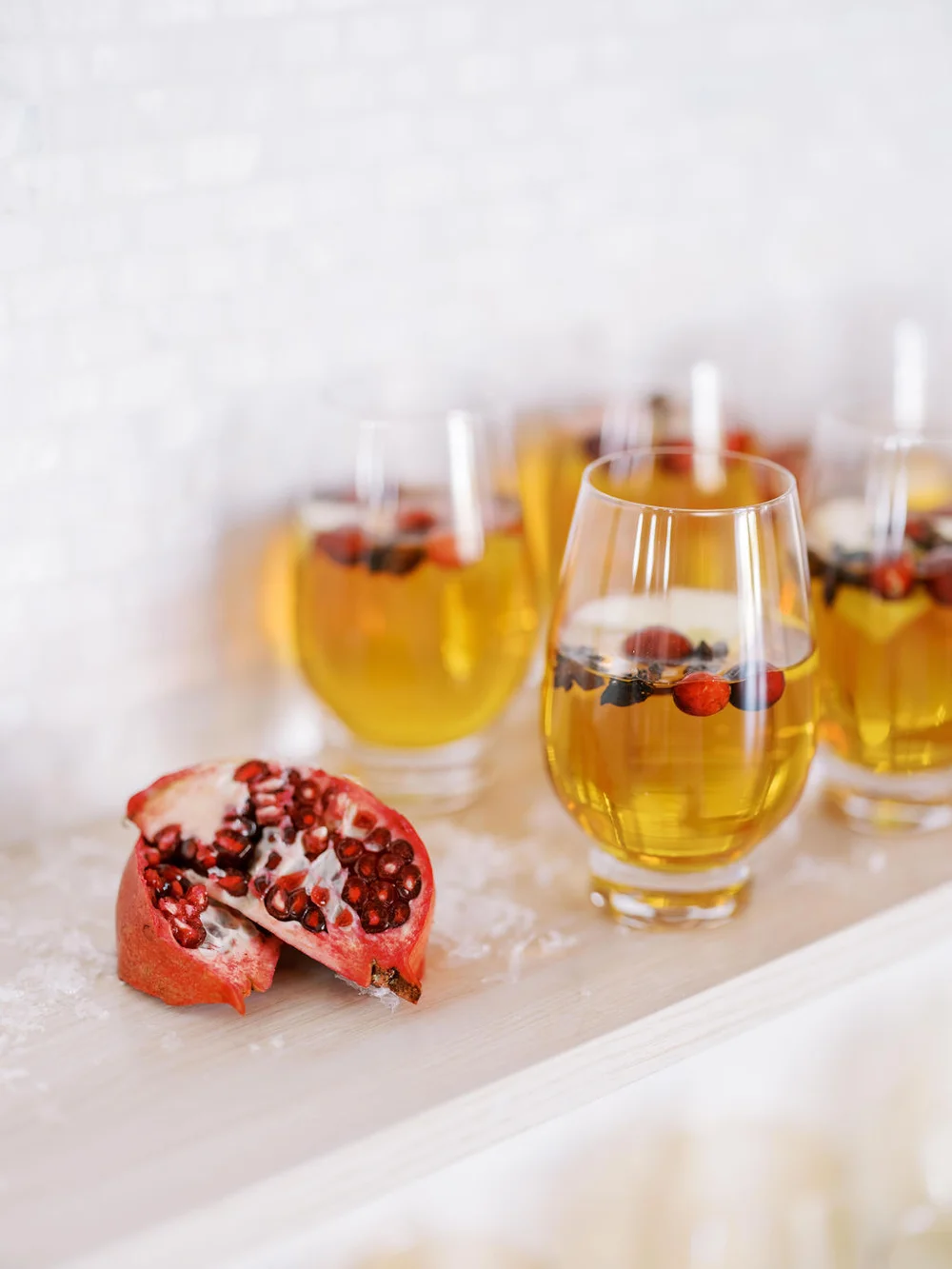 Wine glasses filled with a holiday spritz at company holiday party