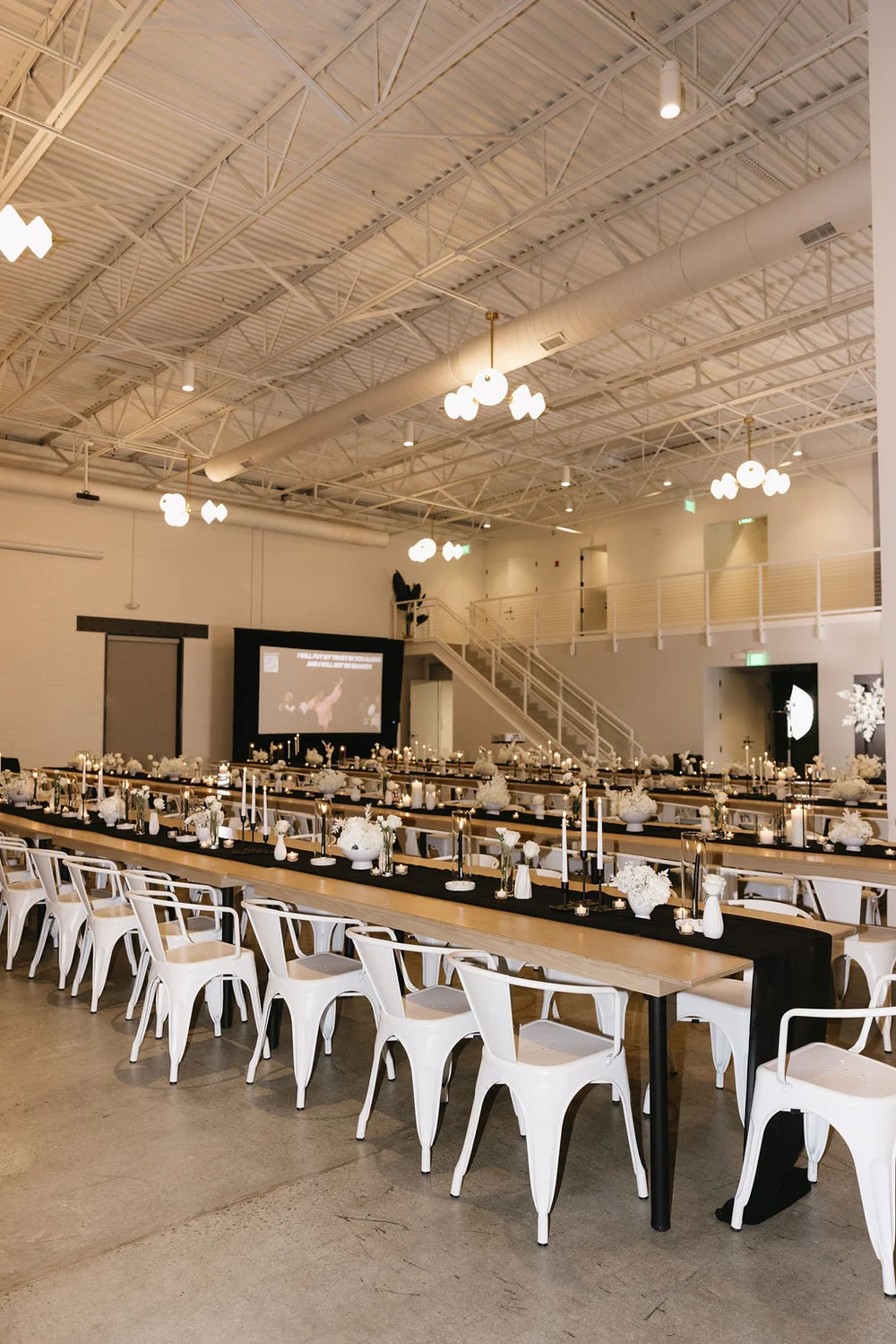 Long tables set up for a company holiday party at PINE in Charlotte, NC.