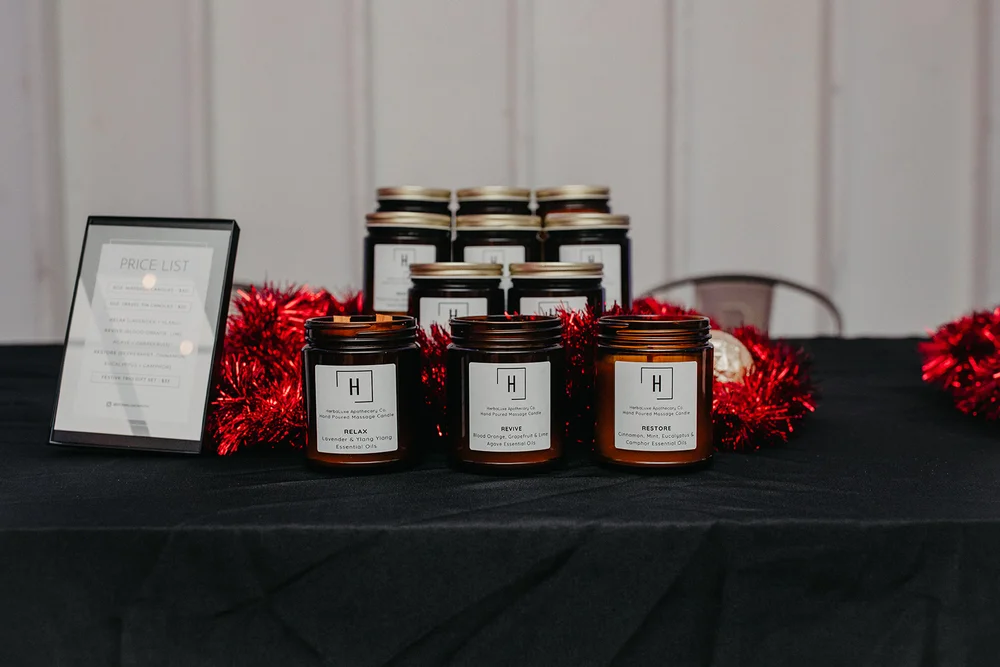 Charlotte office holiday party gift table with candles at PINE venue