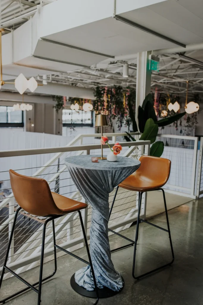 Cocktail tables setup on the mezzanine at PINE in Charlotte