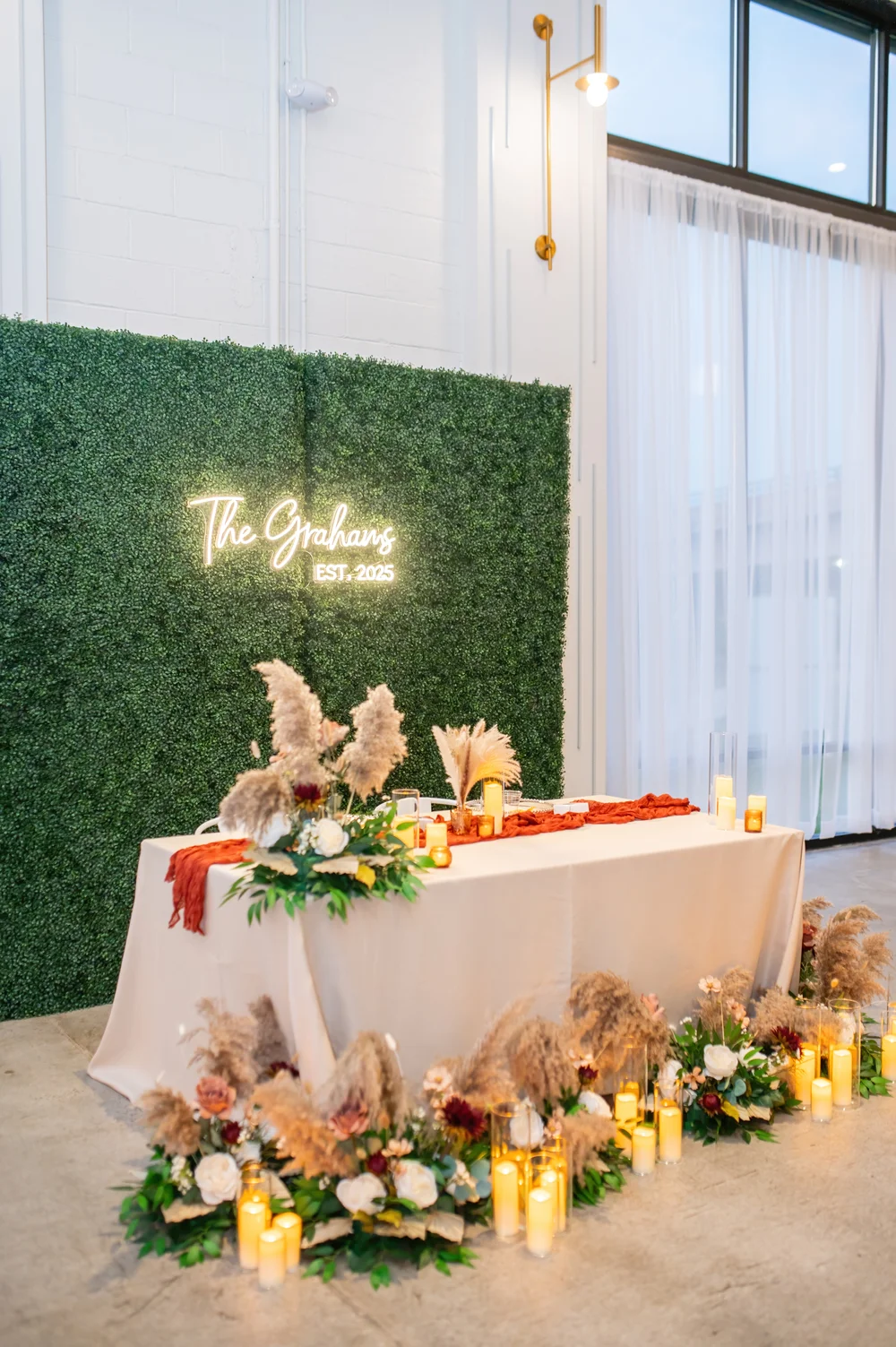 Sweetheart table at PINE in Charlotte, NC featuring boho-industrial fall wedding décor