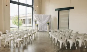 Intimate wedding ceremony with draped backdrop