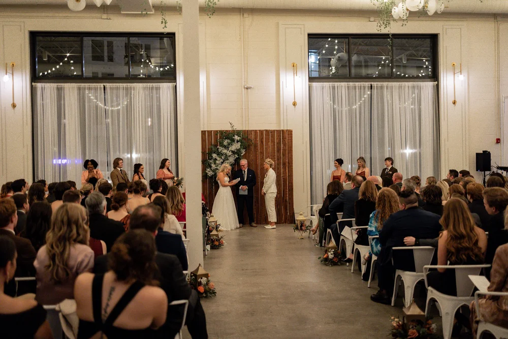 LGBTQ+ brides saying their vows at PINE wedding venue in Charlotte NC