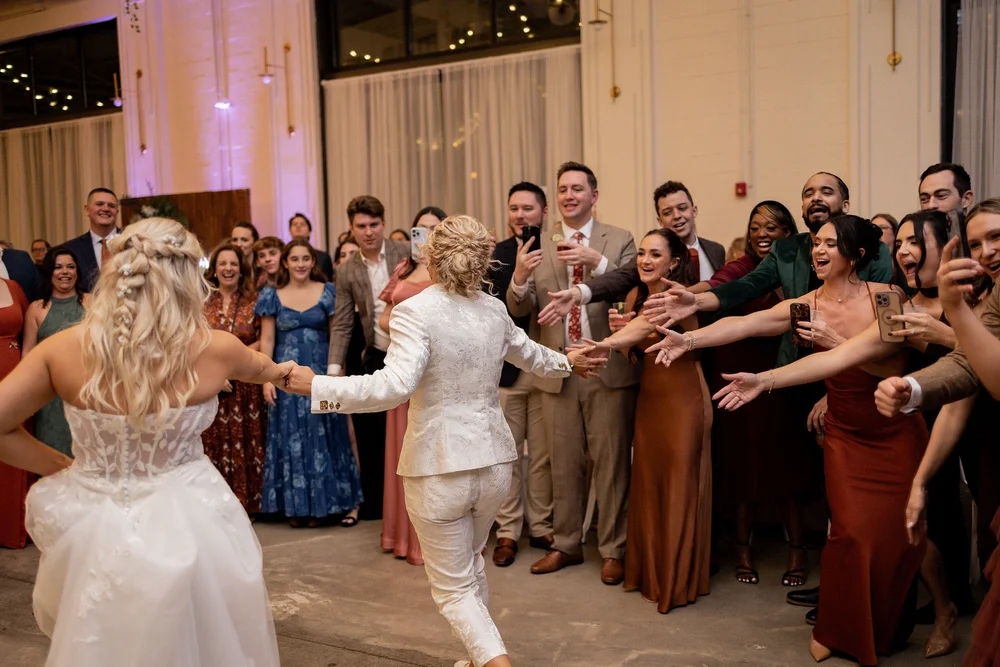 LGBTQ+ brides dancing at their wedding reception at PINE in Charlotte NC